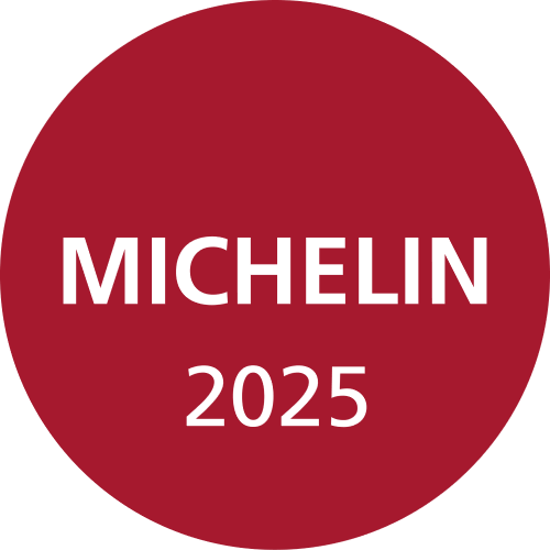 round red logo with white letters