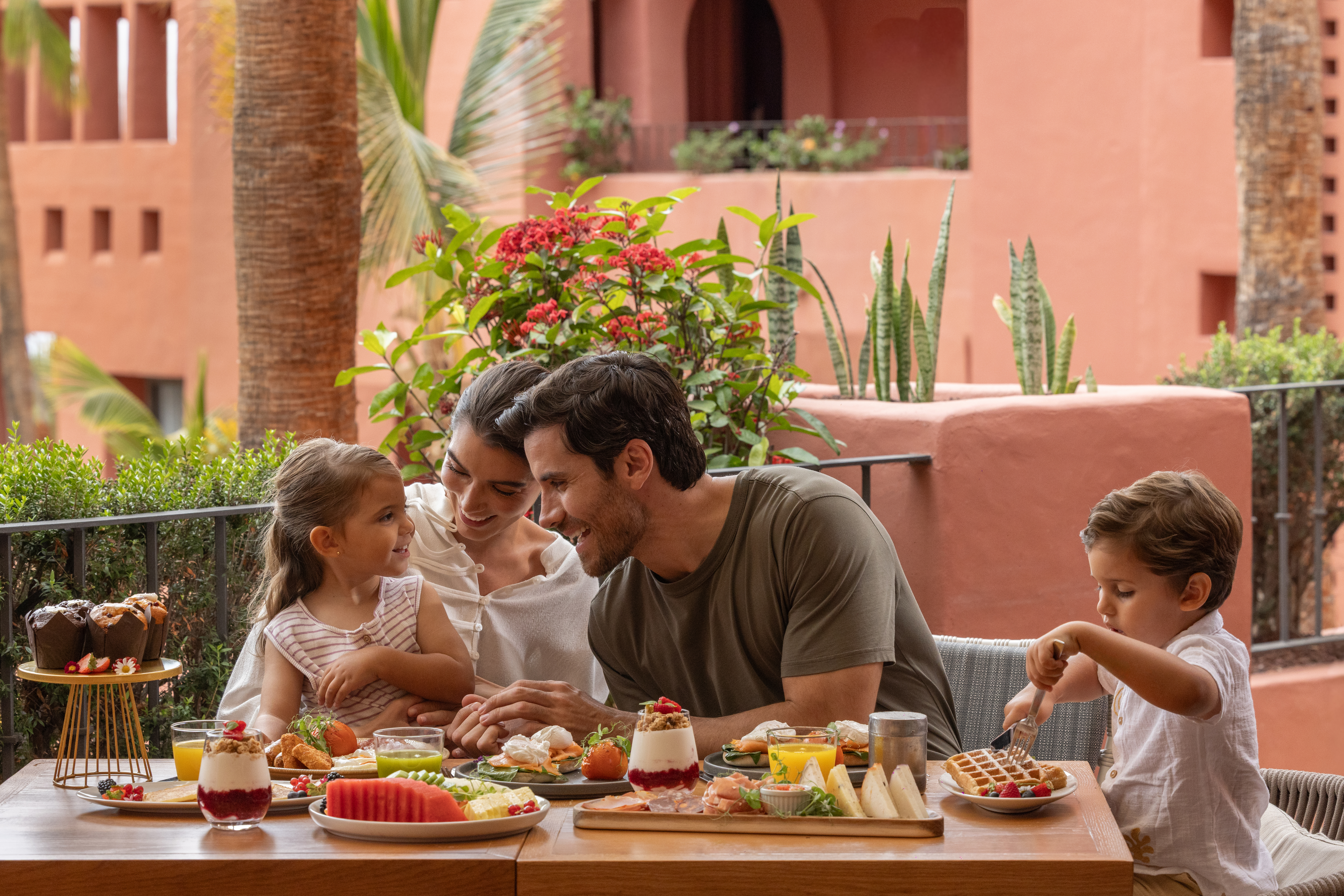 Family enjoying breakfast outdoors