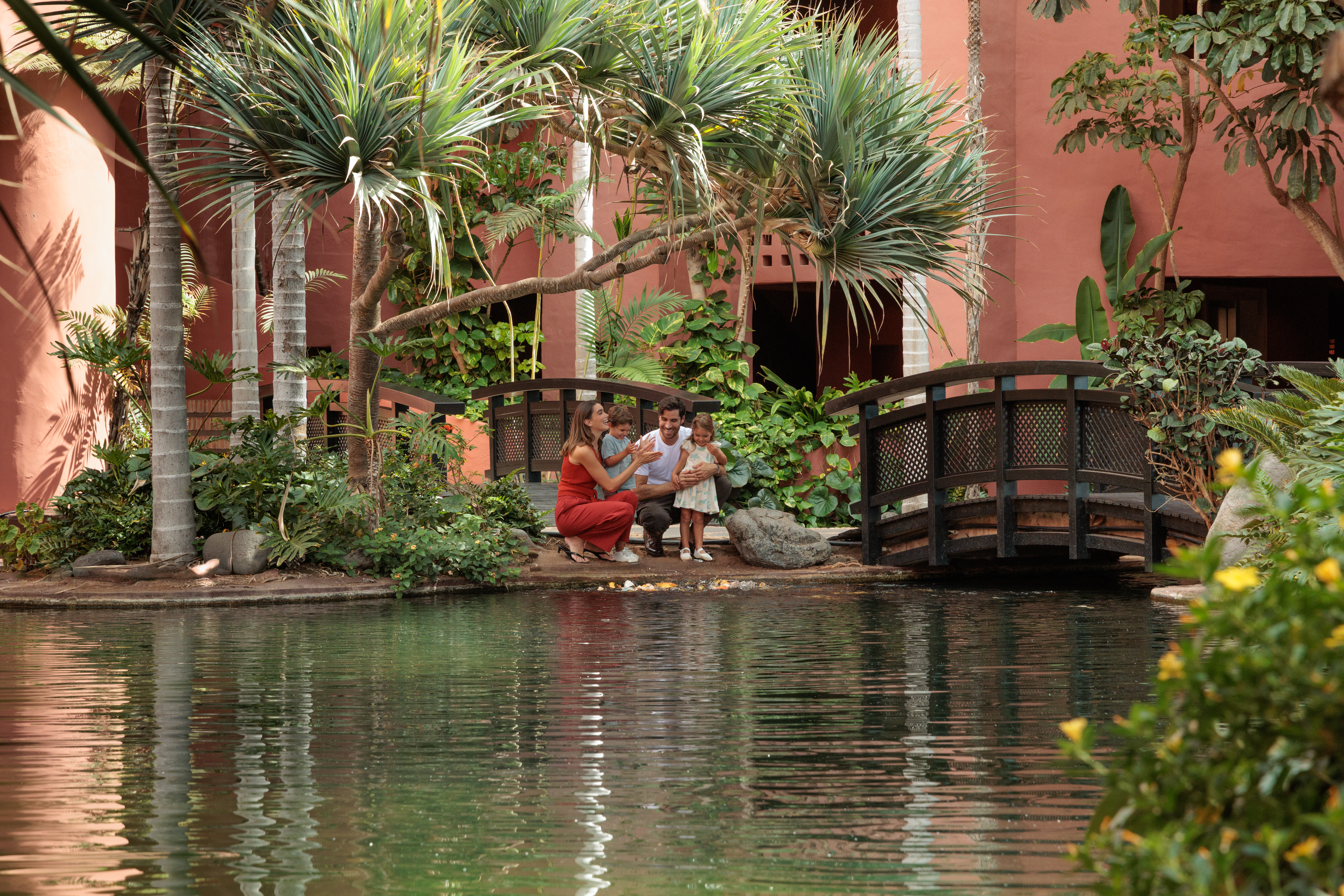 Family by koi pond and gardens